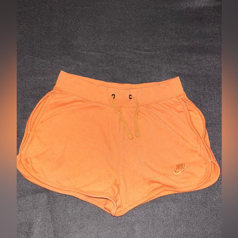 NWOT orange NIKE drawstring shorts. Size Small with 2” inseam
